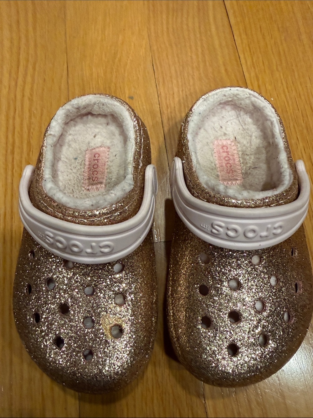 Crocs girl pink glitter lined clogs size C9.